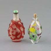 A Chinese six colour overlaid glass snuff bottle and a red overlaid snowflake ground glass snuff