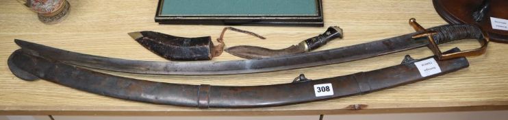 A French sabre, length 89cm and a kukri