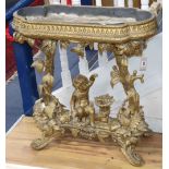 A Victorian carved giltwood and gesso jardinière table, child and trees underframe, W.83cm