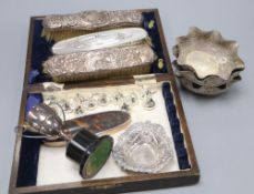 A set of four Indian white metal bon-bon dishes, 11cm, a silver nut dish, a small trophy cup and