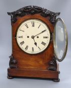 A Regency mahogany eight day bracket clock, with a carved domed top, height 45cm