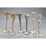 A pair of George V silver candlesticks, (lacking one sconce) 20cm, a pair of specimen vases, 19cm