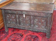 An early 18th century later carved oak coffer, W.127cm