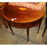 A George III mahogany tulipwood banded 'D' shaped folding card table, chequer and husk inlaid, W.