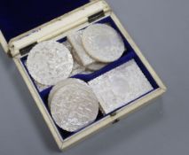 A Chinese carved ivory box with mother of pearl gaming counters