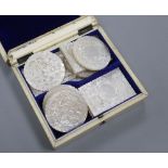 A Chinese carved ivory box with mother of pearl gaming counters