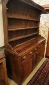 A George III oak dresser, W.160cm, D.48cm, H.197cmCONDITION: The top is marked, scuffed and