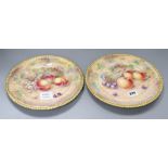 A pair of Aynsley cabinet plates, painted with plums and apples by Paul English, diameter 26cm