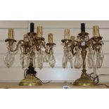 A pair of gilt four branch five light candelabra