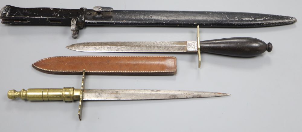 A bayonet and two daggers