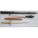 A bayonet and two daggers