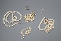 A graduated cultured pearl necklace, 47cm, a single strand pearl necklace, 39cm, a bracelet, another