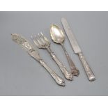 A pair of Victorian silver fish servers with weighted handles, a later dessert serving spoon and a