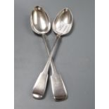 A George III silver fiddle pattern basting spoon, makers Eley & Fearn, London 1801 and a similar