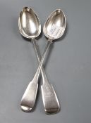 A George III silver fiddle pattern basting spoon, makers Eley & Fearn, London 1801 and a similar