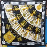 An Hermes silk scarf and a Biba rain cape designed by Mary Quant