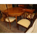 A modern cherrywood 'D' ended extending dining table and a set of four chairs, table diameter 116cm
