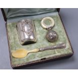 A French white metal christening set comprising tumbler, rattle and ivory bowl and spoon, c.1900, in