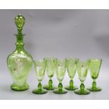 A Victorian 'Mary Gregory' decorated green glass decanter, height 33cm and six tumblers