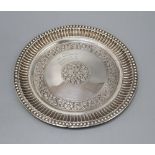 An Indian white metal salver, with floral decoration inscribed from His Highness Maharana of