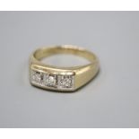 A 9ct. gold three stone diamond ring, larger than size Z, gross 7.3 grams