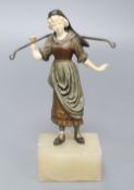 A 19th century cold painted bronze and ivory figure of a milkmaid, on an onyx base, overall height