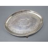 A George III silver teapot stand, with bright cut engraving, London 1792, 18cm, 3oz.