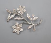 An 18ct white gold and diamond flower spray brooch, in Catchpole & Williams box, 4cm, gross 5.8