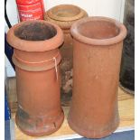 Three terracotta chimney pots, tallest 62cm