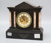A French black and rouge marble eight day mantel clock