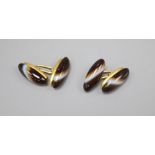 A pair of yellow metal and agate cufflinks