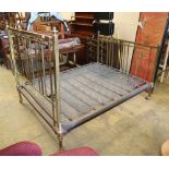 An early 20th century squared brass double bed frame, W.150cm