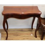 A 19th century French mahogany serpentine folding top tea table, W.86cm