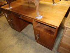 An Art Deco style chrome mounted walnut pedestal desk, W.150cm, D.75cm, H.75cmCONDITION: Top is