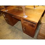 An Art Deco style chrome mounted walnut pedestal desk, W.150cm, D.75cm, H.75cmCONDITION: Top is