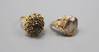 An 18k gold cabochon and sapphire cluster ring, size L, gross 5.9 grams and a 9ct. gold gem set