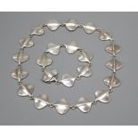 A Georg Jensen silver necklace with stylised oval links, number 176 and matching bracelet, number