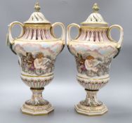 A pair of Ginori Doccia two handled lidded waisted baluster vases, in Capodimonte style moulded in