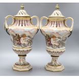 A pair of Ginori Doccia two handled lidded waisted baluster vases, in Capodimonte style moulded in