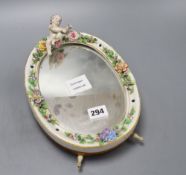 A German porcelain floral encrusted easel mirror, height 28cm