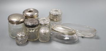 Eight assorted silver lidded glass toilet jars, a further glass jar lacking lid and a small pair