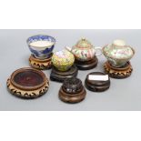 A Chinese cantonese tea bowl and cover on stand, another teapot on stand and others