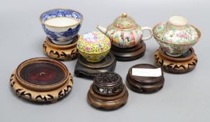 A Chinese cantonese tea bowl and cover on stand, another teapot on stand and others