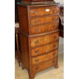 A small walnut reproduction bow front tallboy, W.56cm, H.110cm