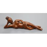 A Chinese wood figure of a reclining nude, width 20cm