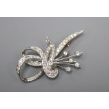 An 18ct white gold? and diamond scroll and spray brooch, 4.5cm, gross 7.8 grams