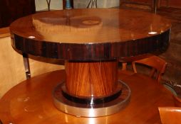 A 1930's mahogany and ebonised circular topped coffee table, with chrome bordered plinth, diameter
