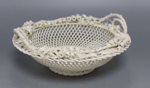 A Belleek white glazed pierced basket with Lily of the Valley borders, diameter 24cm