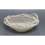 A Belleek white glazed pierced basket with Lily of the Valley borders, diameter 24cm