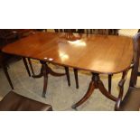 A small Regency design mahogany two pillar dining table, one spare leaf, W.166cm, D.86cm,